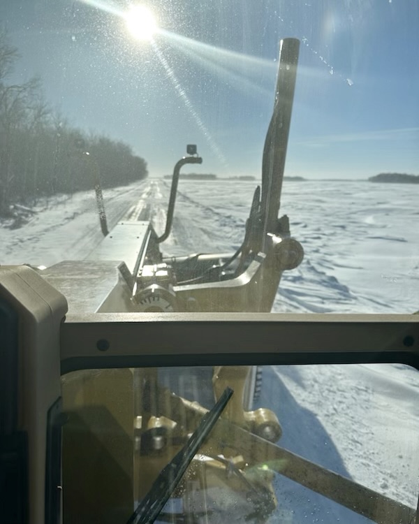 picture of us blading a road in the winter